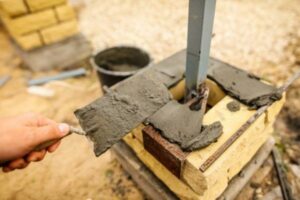 the-worker-is-laying-bricks-on-the-fence+1