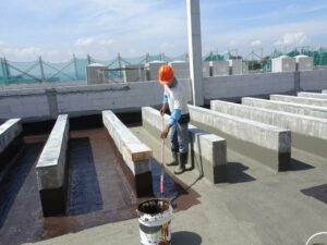 construction-workers-on-top-of-concrete-slab-waterproofing+1
